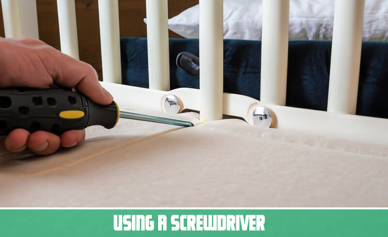 Using a screwdriver for Crib Mattress